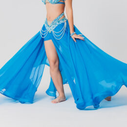Portrait of belly dancer girl in blue. isolated on white